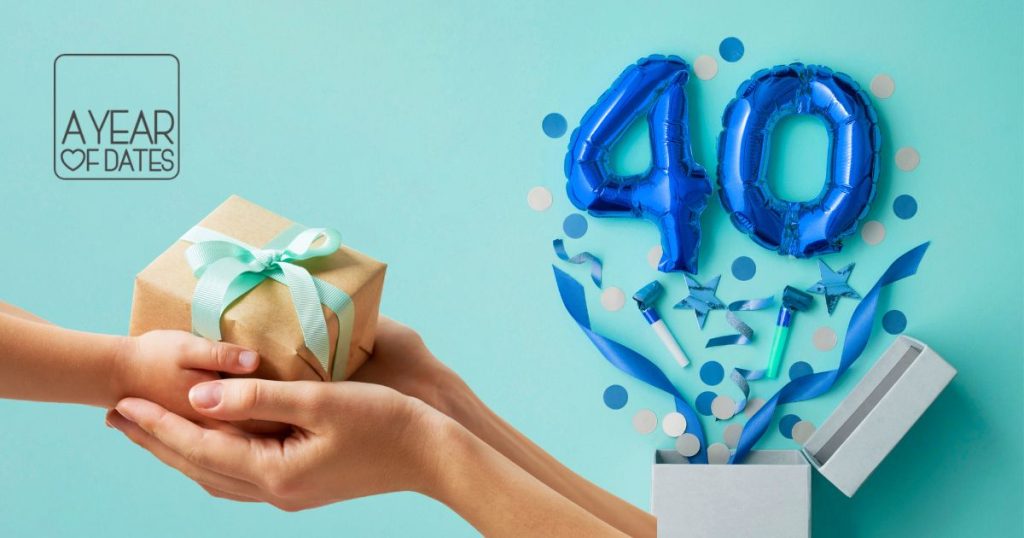 Hands passing a kraft paper gift box with a teal ribbon, next to blue foil 40 balloons bursting from a white gift box, 40th birthday gift ideas UK, A Year of Dates